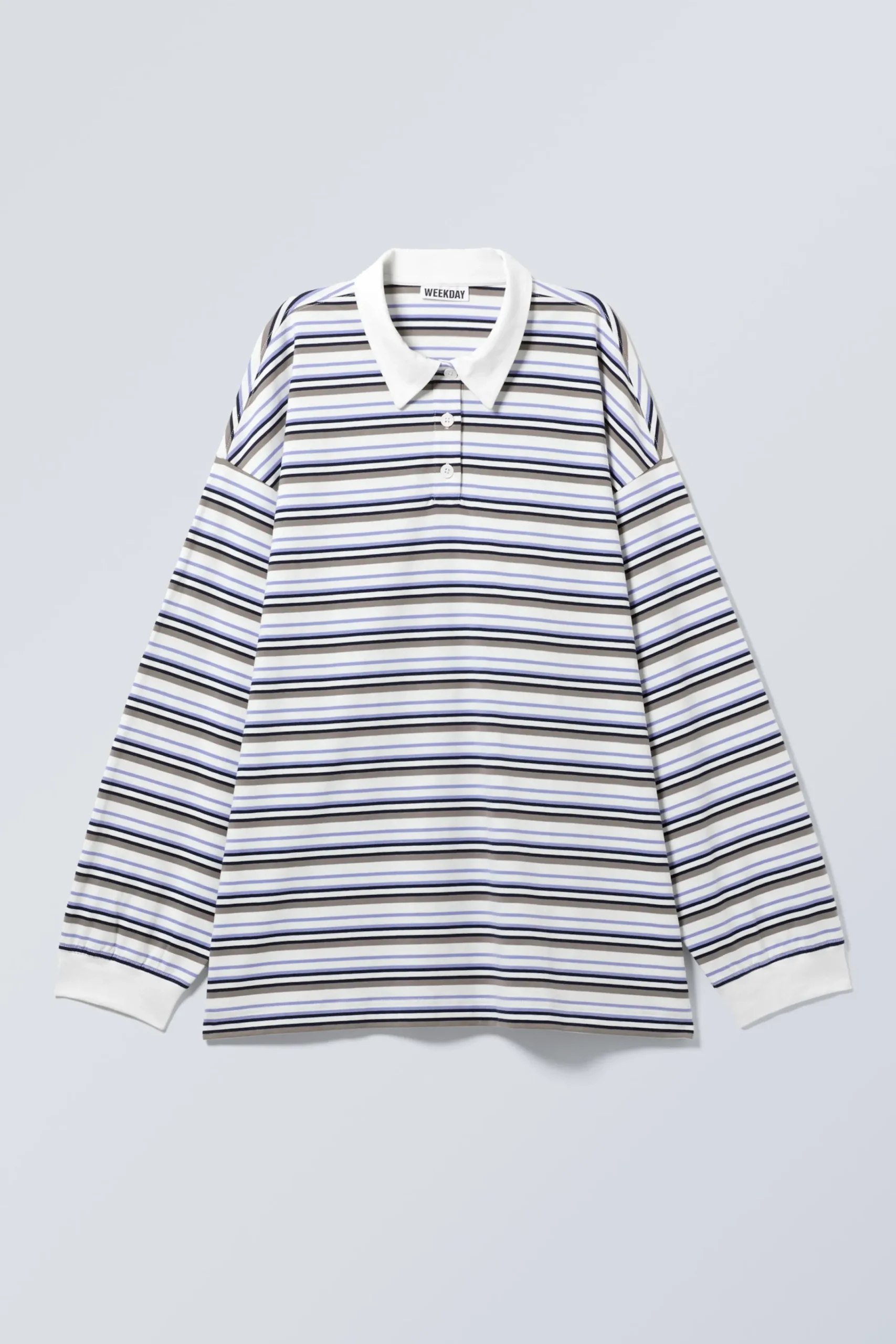 randig_oversized_piktrja_3.webp Weekday Toppar<RANDIG OVERSIZED PIKÉTRÖJA